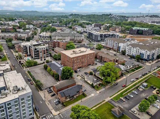 an aerial view of a house with a garden