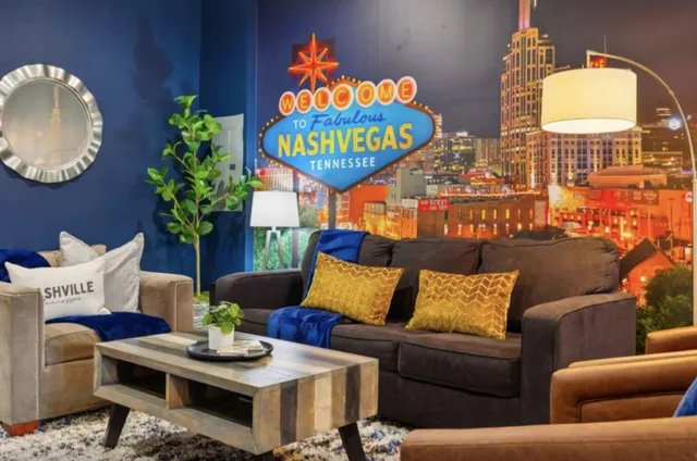 a couch sitting in a living room with a rug