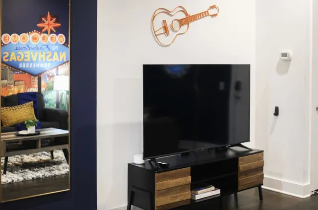 a room with a table and a potted plant