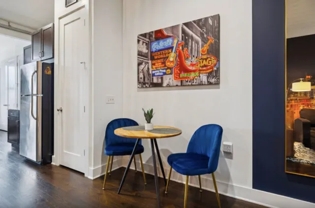 a view of a livingroom with furniture and wooden floor
