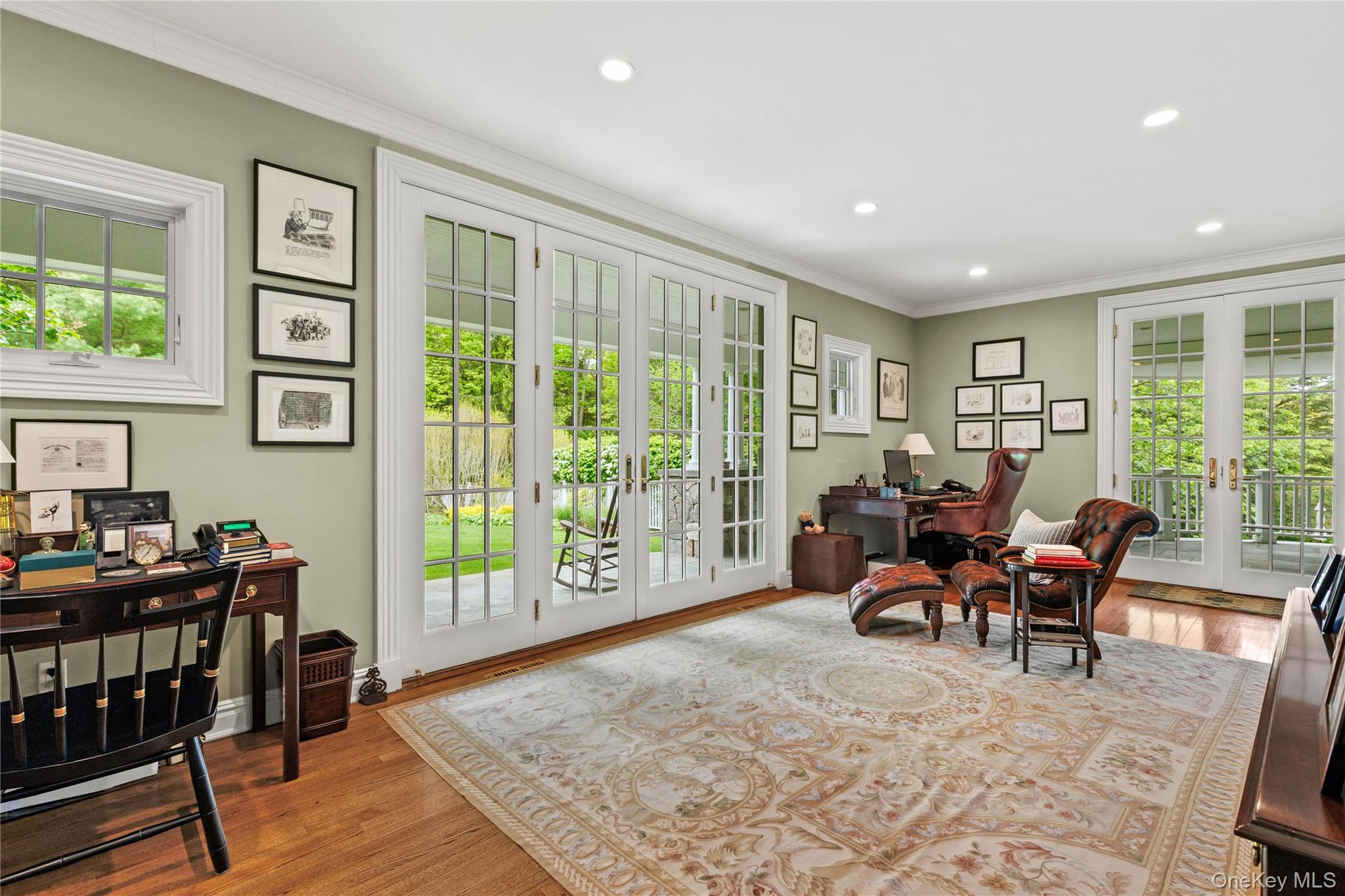 63 Old Mill River Road Pound Ridge, NY 10576 - Photo 18 of 47 a living room with furniture and a flat screen tv
