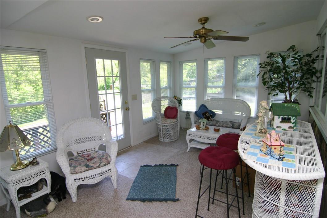 5969 Fitzgerald Road Rockford, IL 61102 - Photo 19 of 25 a living room with furniture and a large window