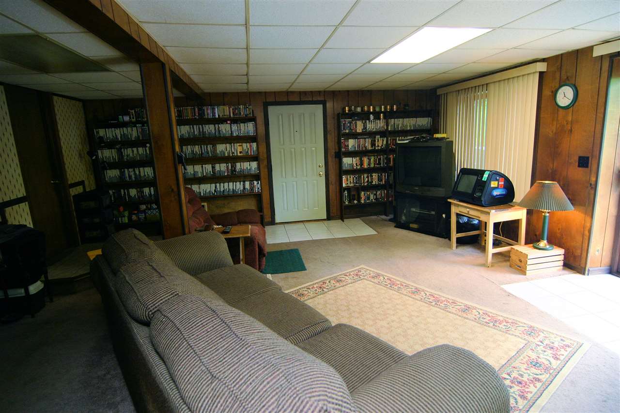 5969 Fitzgerald Road Rockford, IL 61102 - Photo 24 of 25 a bed room with a bed and a book shelf