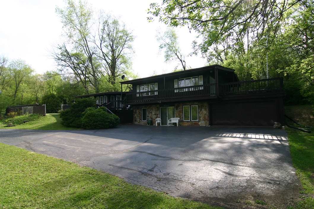 5969 Fitzgerald Road Rockford, IL 61102 - Photo 3 of 25 a view of a house with a yard