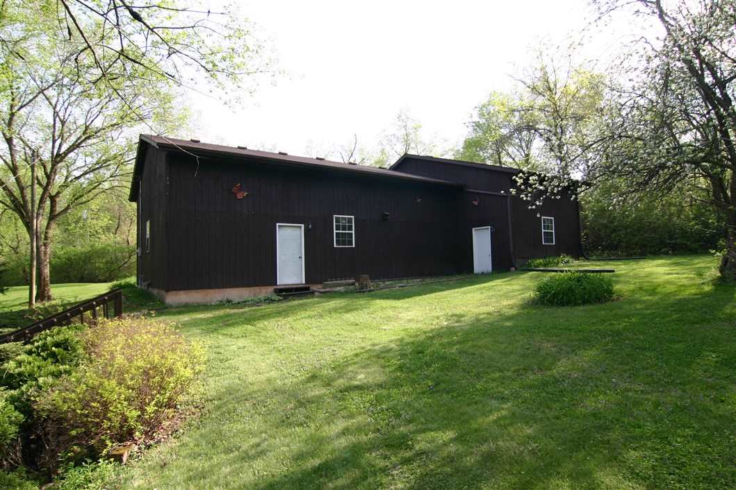 5969 Fitzgerald Road Rockford, IL 61102 - Photo 8 of 25 a backyard of a house with lots of green space