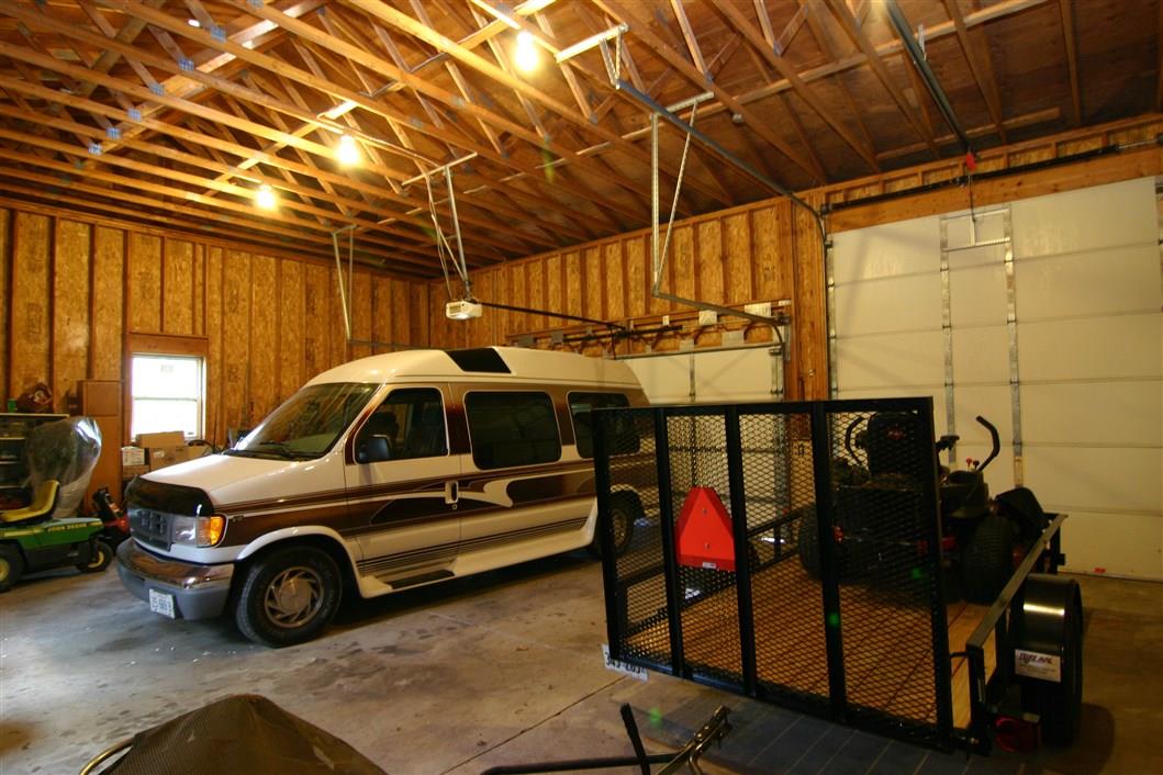 5969 Fitzgerald Road Rockford, IL 61102 - Photo 9 of 25 a view of car parked in garage