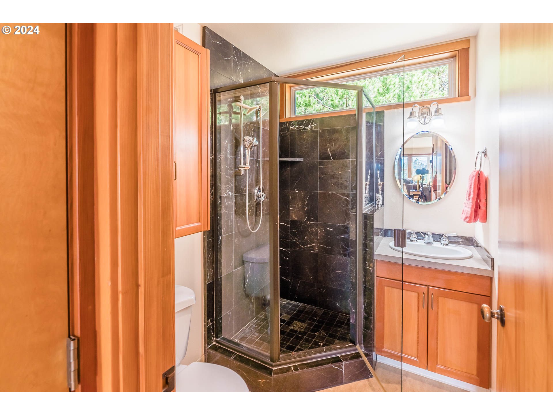 Ridge Road Pacific City, OR 97135 - Photo 26 of 34 a bathroom with a glass shower door