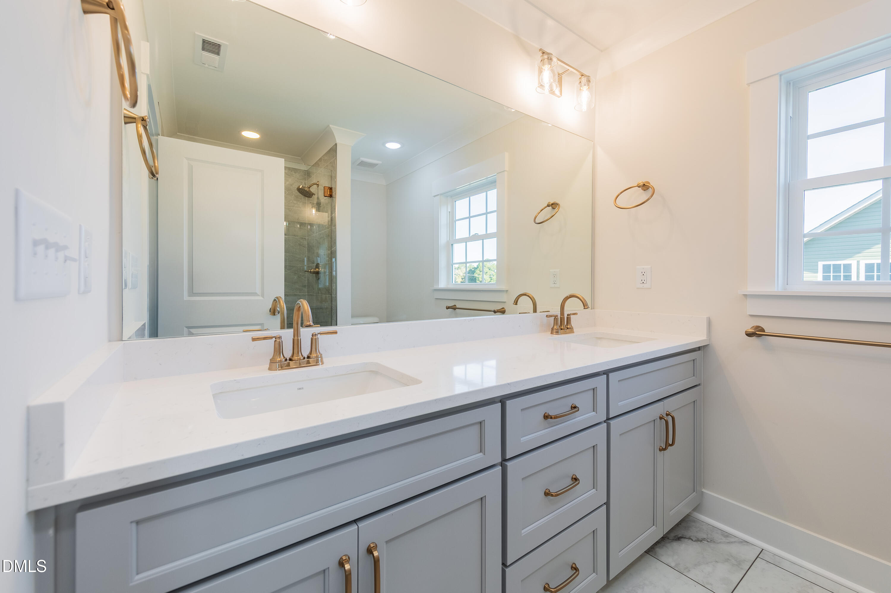 4251 Old Stage Road North Angier, NC 27501 - Photo 24 of 34 a bathroom with double vanity sink and a mirror