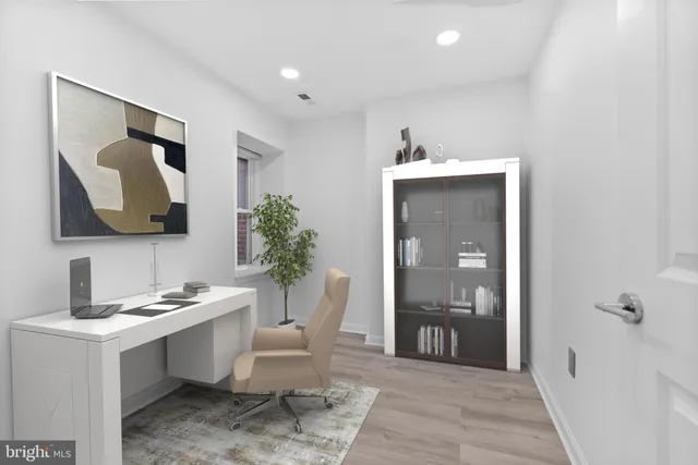 a view of a brick building with large windows