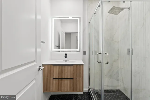 a bedroom with a large bed and potted plant