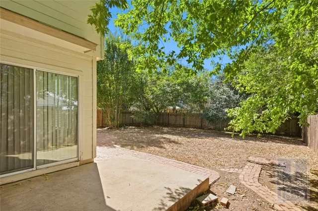 a view of a backyard of a house