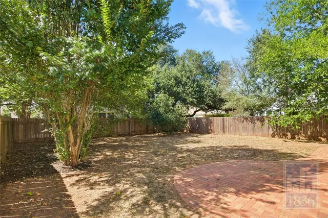 a view of backyard with green space