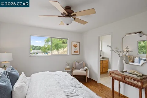 a bedroom with furniture and a window