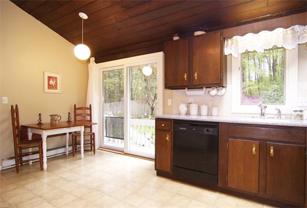 115 Pine Hill Road Boxborough, MA 01719 - Photo 11 of 28 a kitchen with stainless steel appliances granite countertop sink cabinets and wooden floor