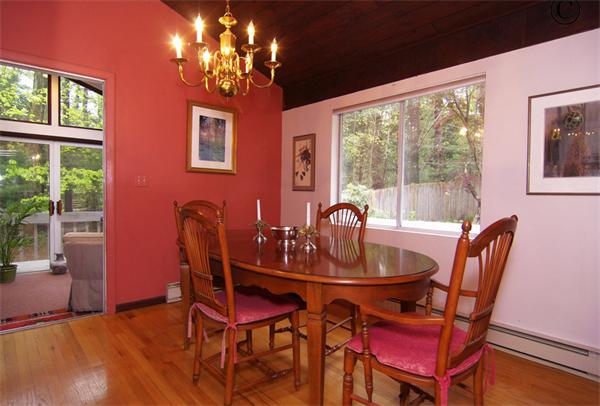 115 Pine Hill Road Boxborough, MA 01719 - Photo 13 of 28 a dining room with furniture a large window and wooden floor
