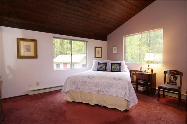 115 Pine Hill Road Boxborough, MA 01719 - Photo 16 of 28 a spacious bedroom with a bed and wooden floor