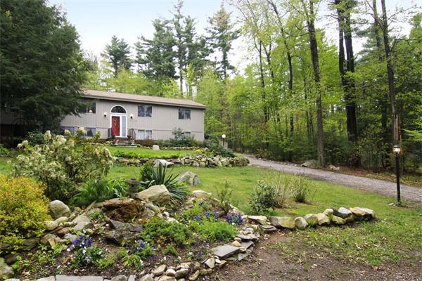 115 Pine Hill Road Boxborough, MA 01719 - Photo 3 of 28 a backyard of a house with lots of green space