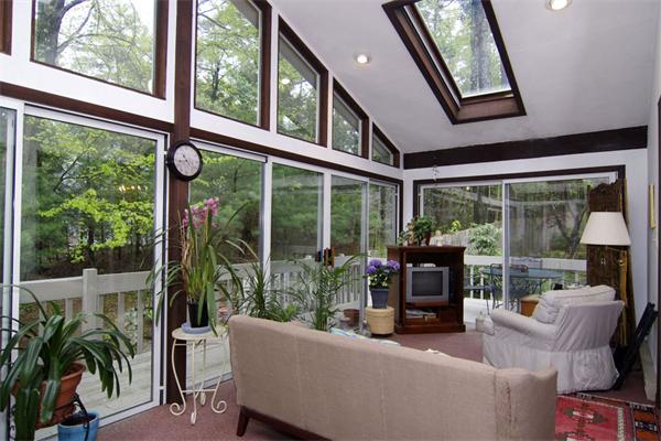 115 Pine Hill Road Boxborough, MA 01719 - Photo 8 of 28 a living room with patio furniture and garden view