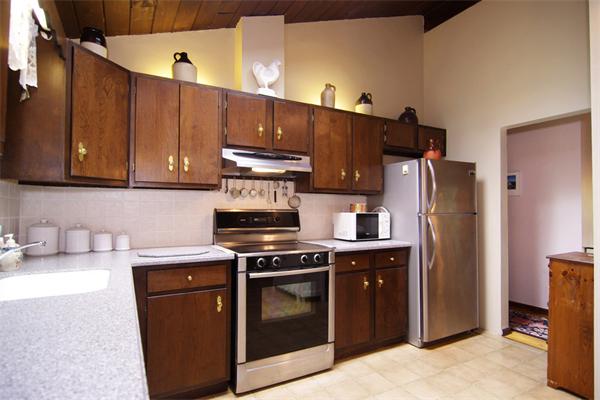 115 Pine Hill Road Boxborough, MA 01719 - Photo 10 of 28 a kitchen with stainless steel appliances a stove and a refrigerator