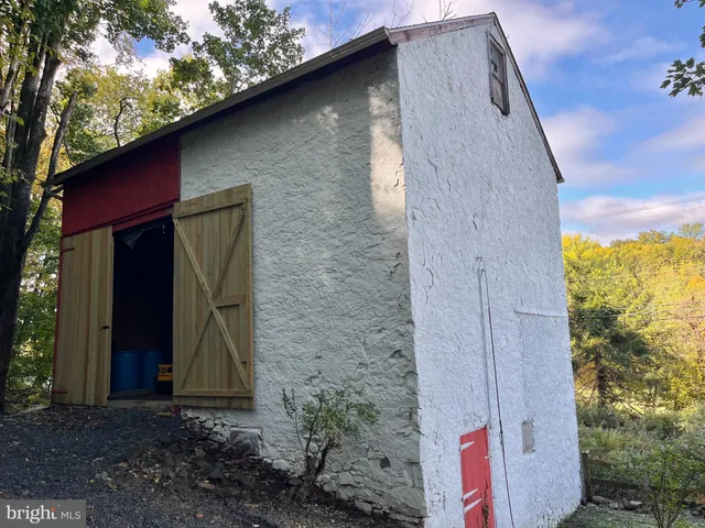 a brick building with a small yard