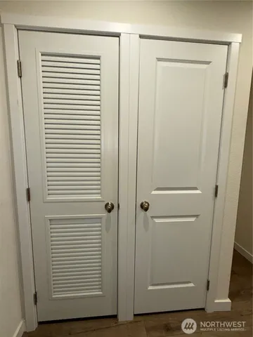 a view of a bathroom with a wooden floor