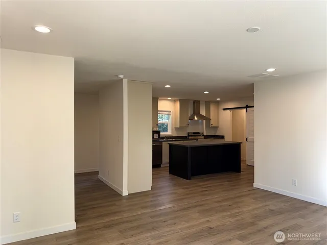 a kitchen with a refrigerator and a sink