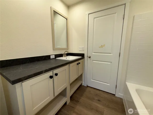 a utility room with cabinets washer and dryer