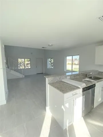 a kitchen with a stove and cabinets