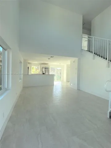 a view of empty room with windows