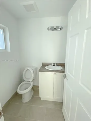 a bathroom with a toilet and a sink