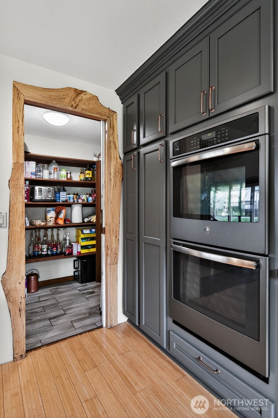91 Goforth Road West Sequim, WA 98382 - Photo 16 of 40 a kitchen with an oven and cabinets