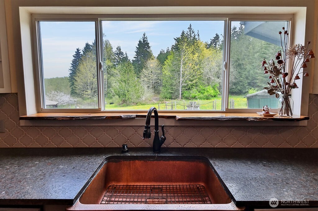 91 Goforth Road West Sequim, WA 98382 - Photo 17 of 40 a view of a window and chair in a balcony
