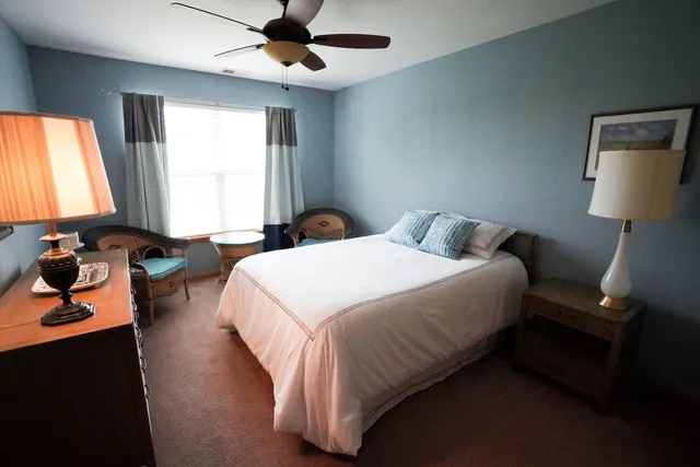 a bedroom with a bed and window