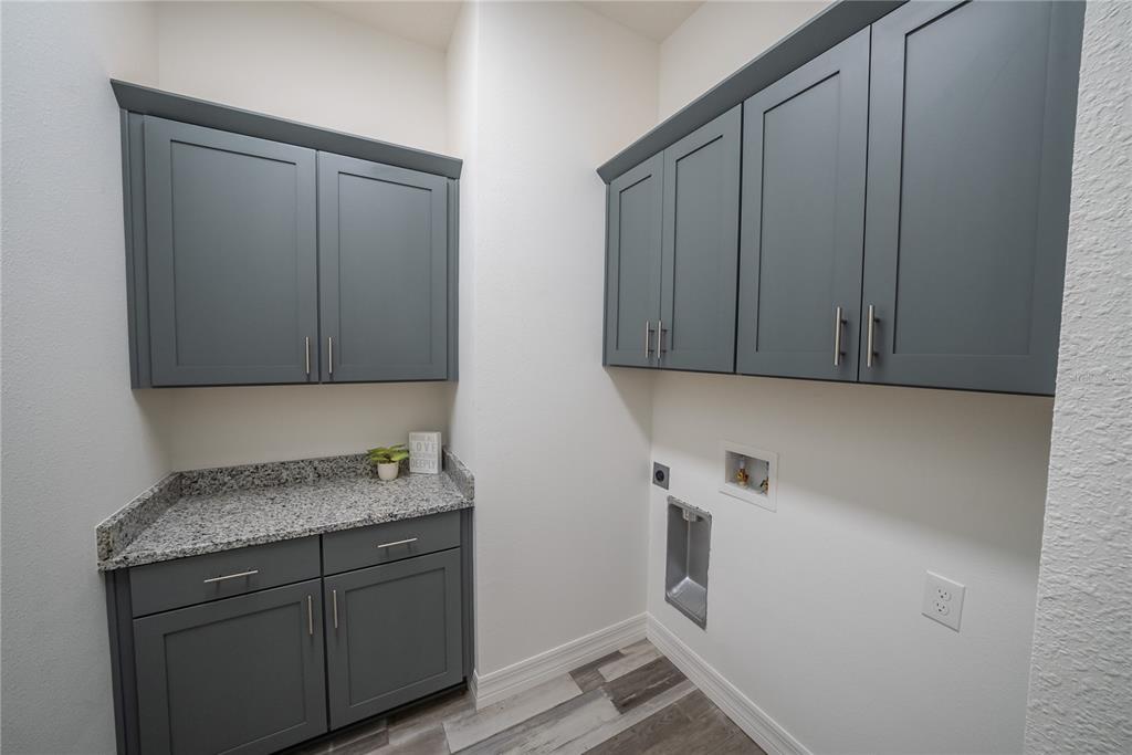4720 Southeast 25th Street Ocala, FL 34480 - Photo 16 of 27 a view of cabinets and wooden floor