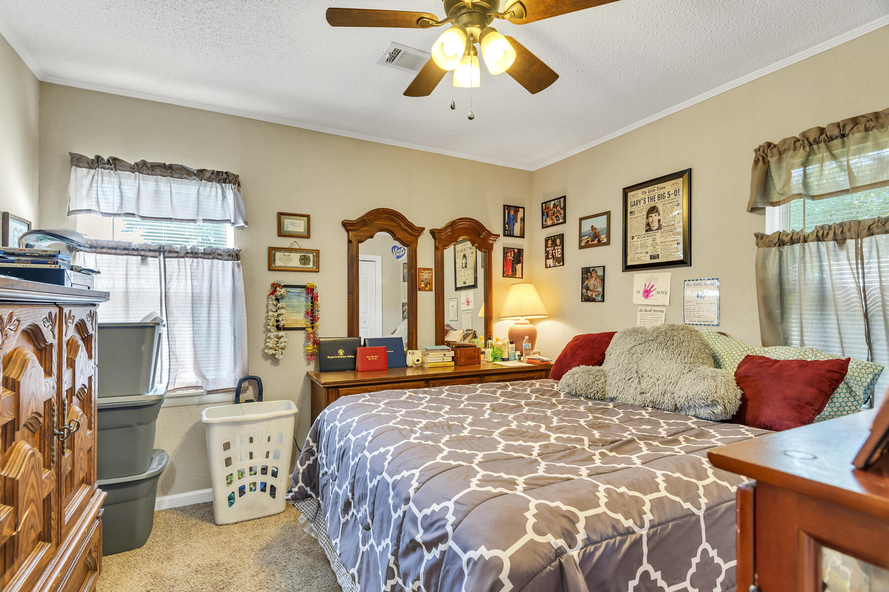 965 Valley Road Crestview, FL 32539 - Photo 13 of 35 a bedroom with a large bed and a chandelier