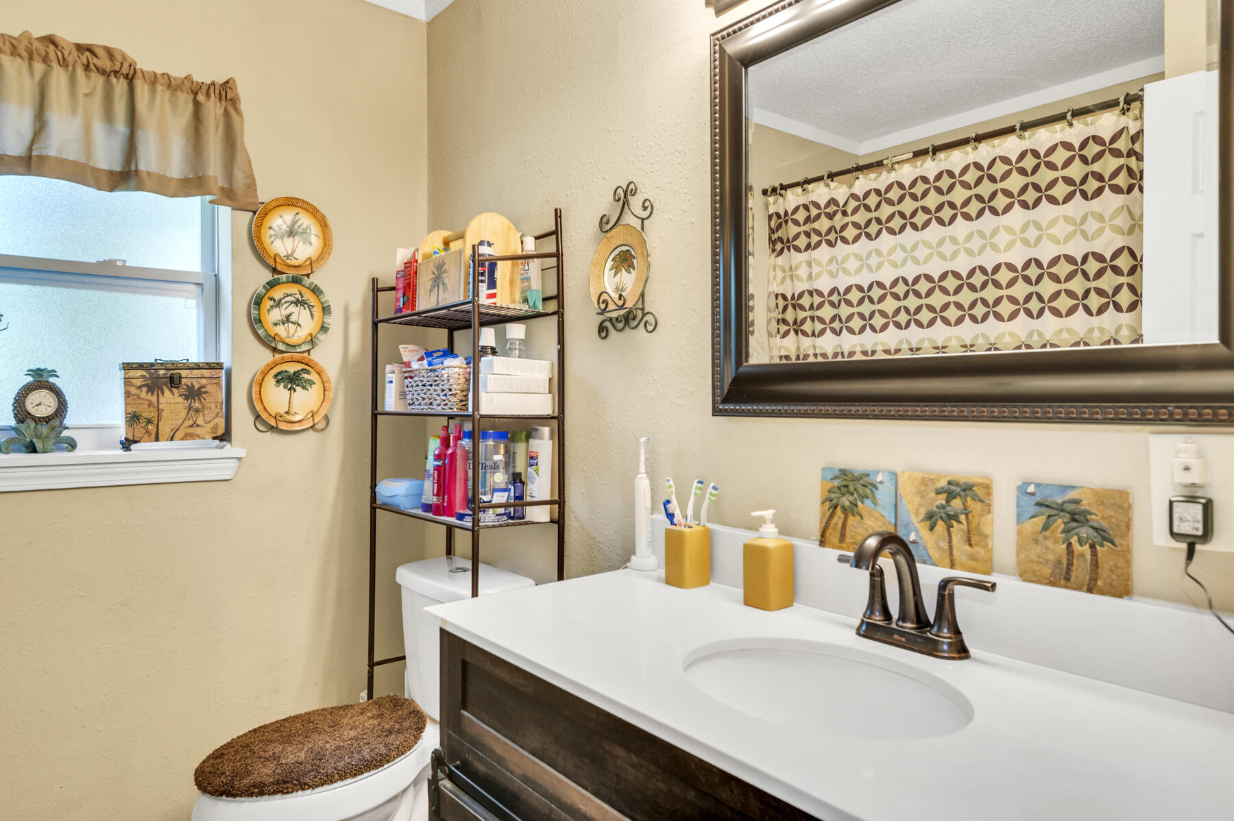 965 Valley Road Crestview, FL 32539 - Photo 15 of 35 a bathroom with a sink a toilet and a shower curtain