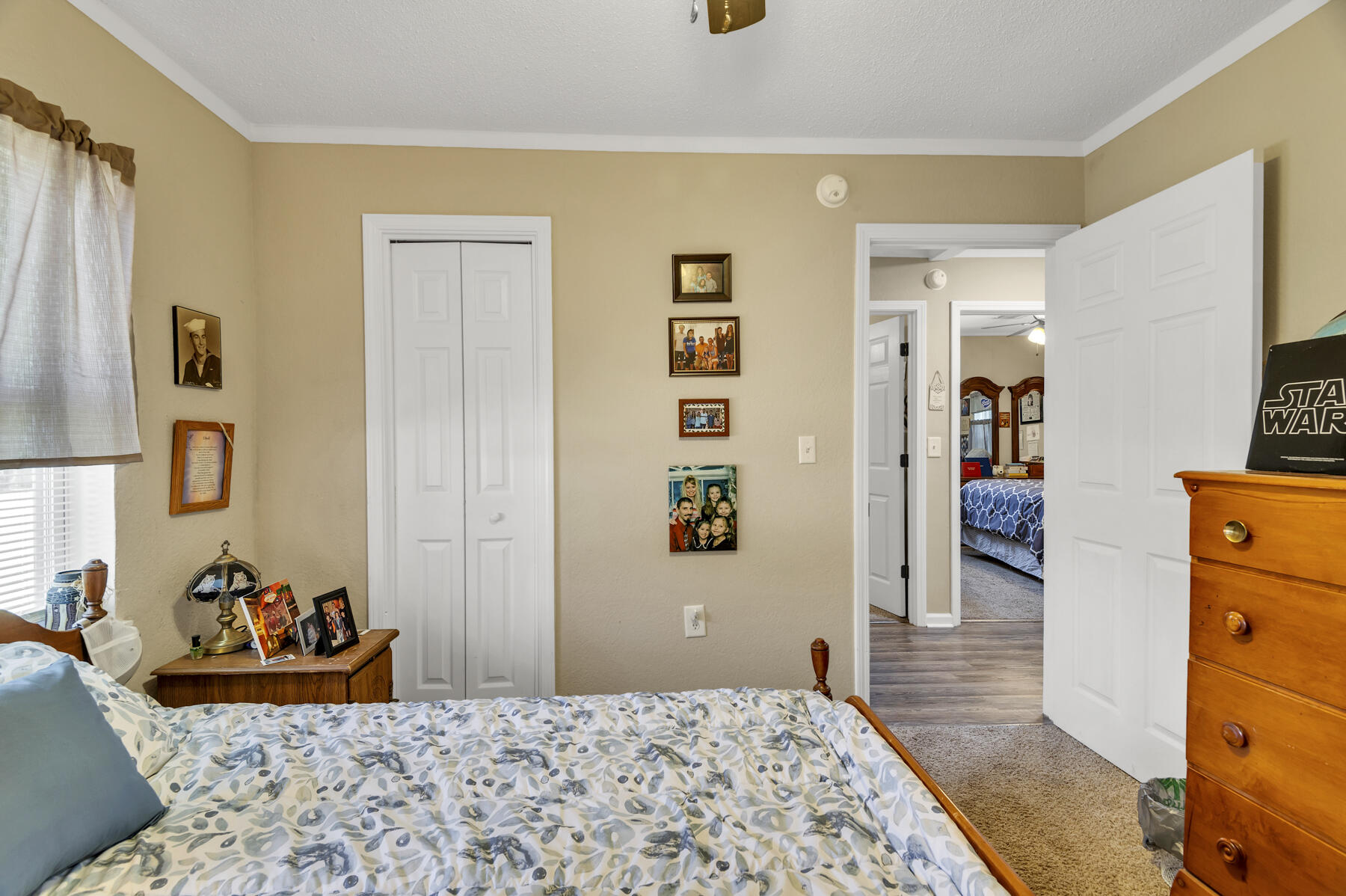 965 Valley Road Crestview, FL 32539 - Photo 19 of 35 a bedroom with a bed and a dresser