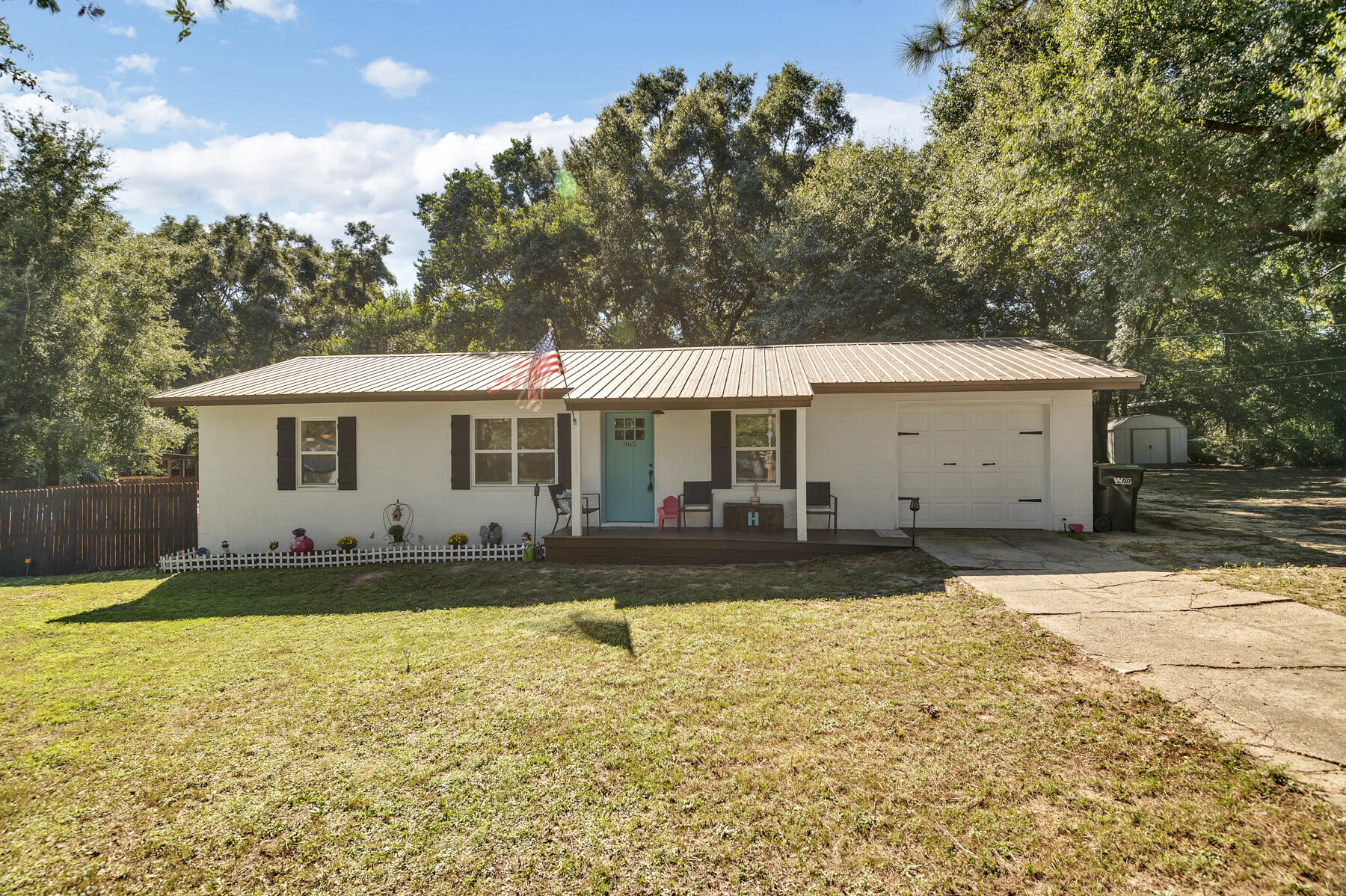 965 Valley Road Crestview, FL 32539 - Photo 2 of 35 a front view of a house with a yard and garage