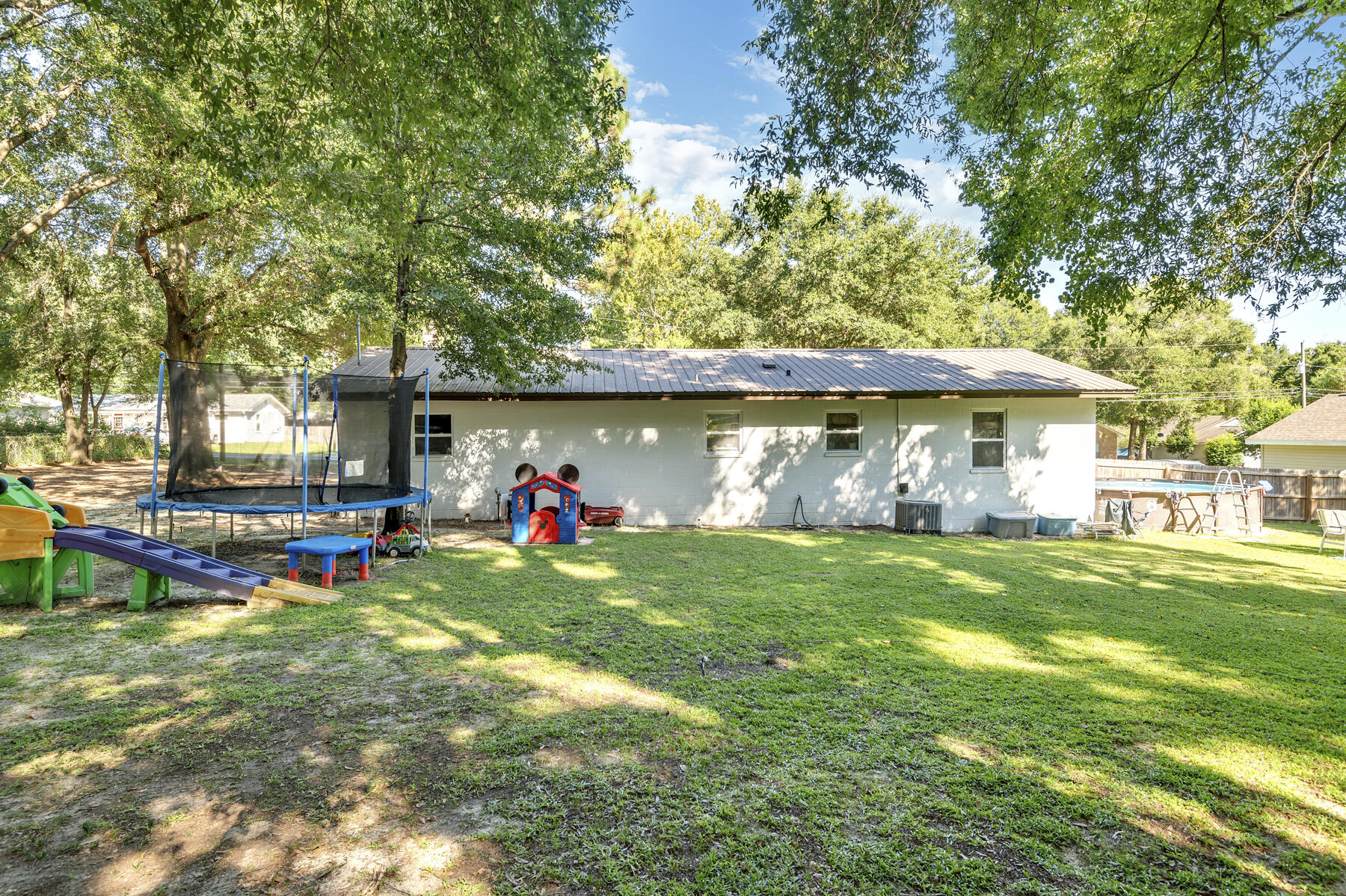 965 Valley Road Crestview, FL 32539 - Photo 24 of 35 a view of a house with a yard and sitting area