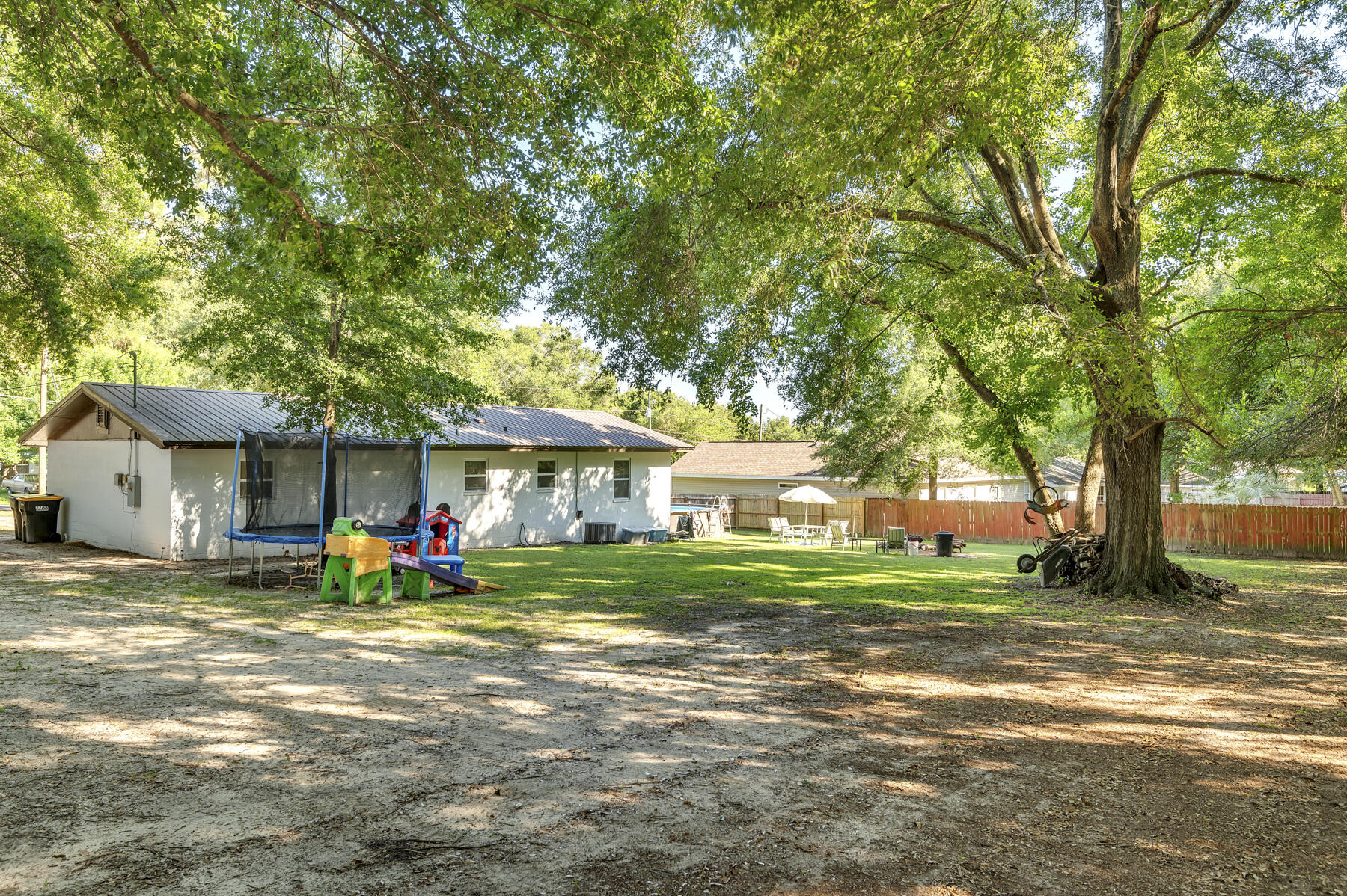 965 Valley Road Crestview, FL 32539 - Photo 25 of 35 a view of a house with a yard and large trees