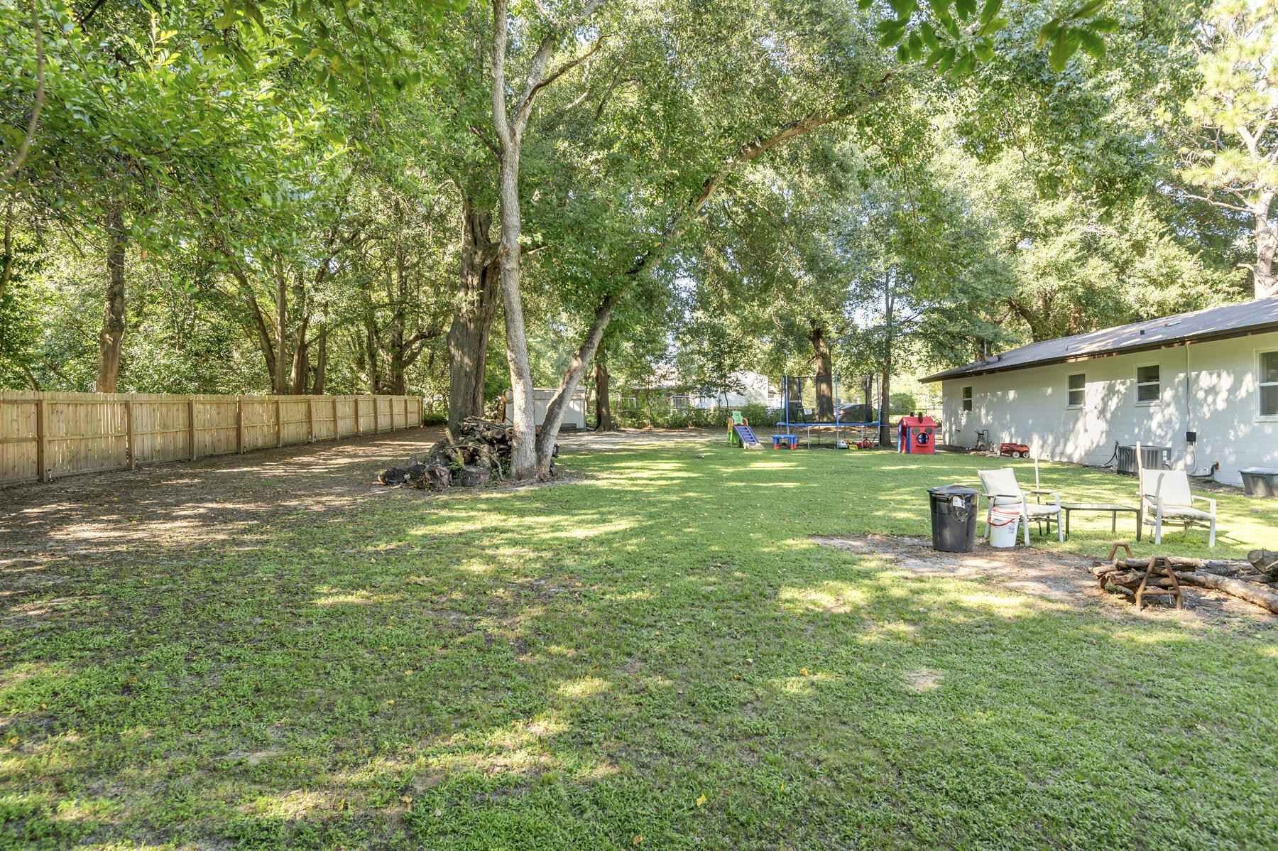 965 Valley Road Crestview, FL 32539 - Photo 26 of 35 a view of backyard with table and chairs and large trees