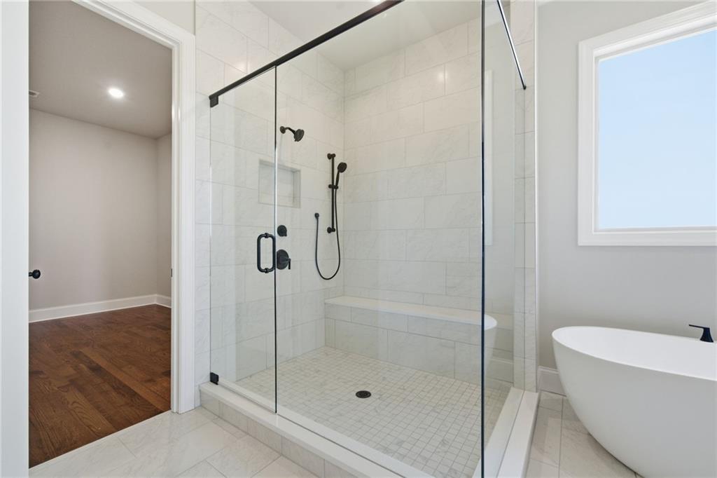 5364 Price Road Gainesville, GA 30506 - Photo 38 of 59 a bathroom with a shower and a bathtub