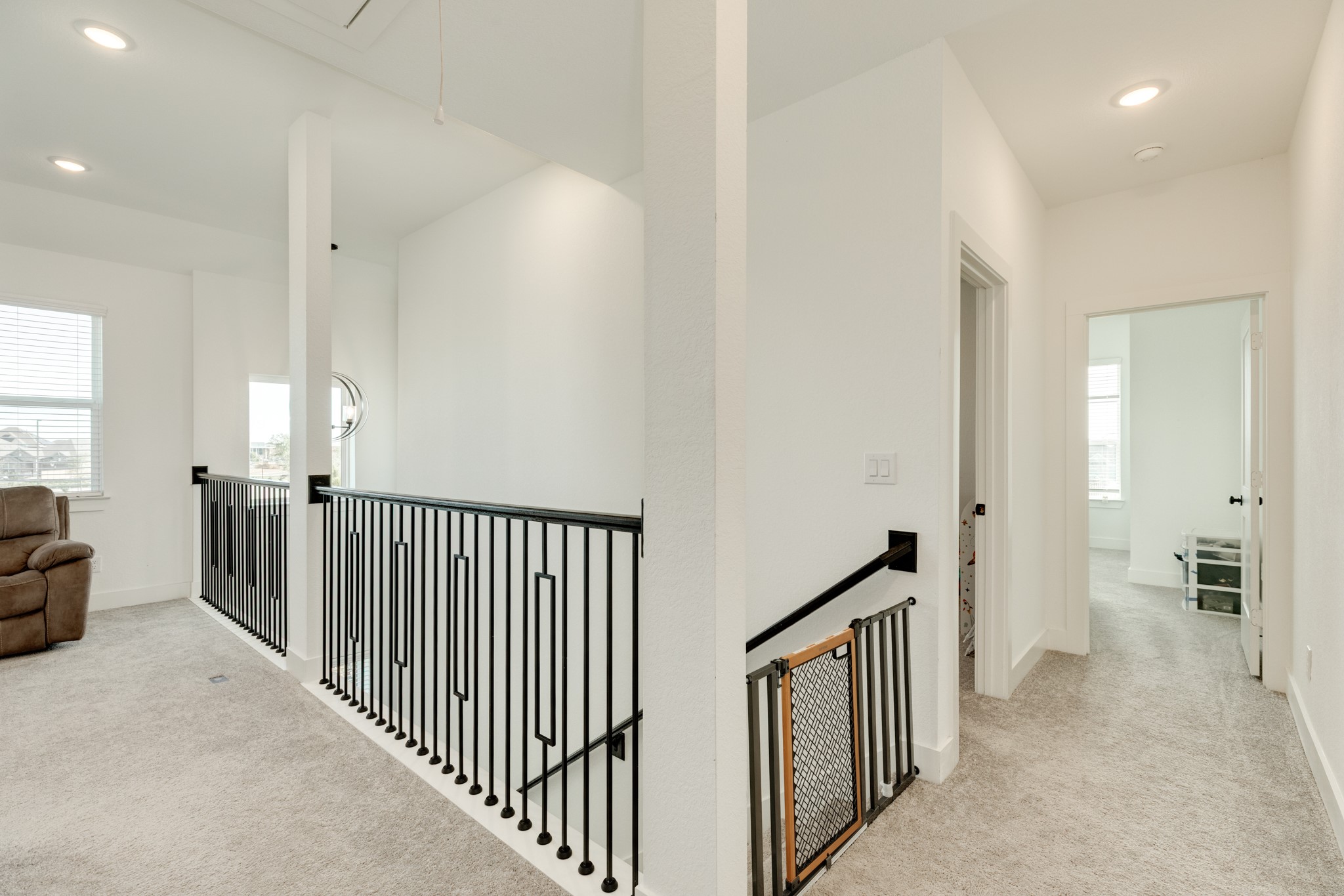 10002 Nectar Path Rosharon, TX 77583 - Photo 14 of 46 Upstairs features a versatile flex room, currently utilized as a secondary family area. This adaptable space could serve as an office or game room, boasting ample square footage and windows for abundant natural light.