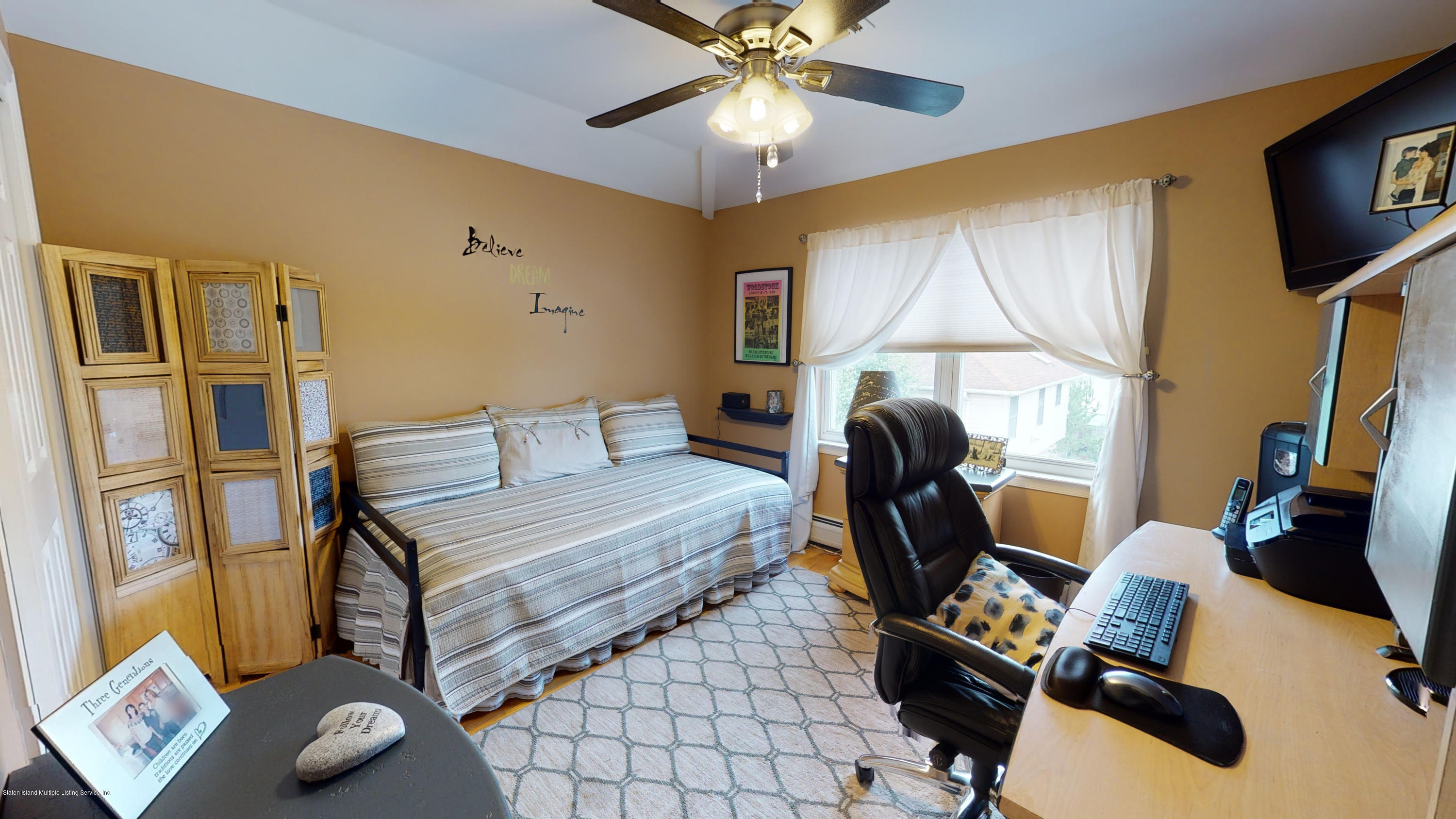103 Covington Circle Staten Island, NY 10312 - Photo 11 of 21 a living room with furniture and a window