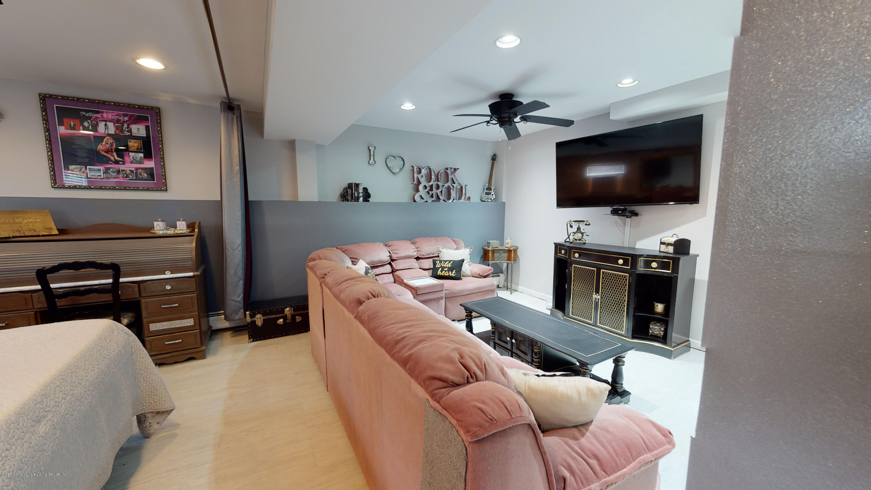 103 Covington Circle Staten Island, NY 10312 - Photo 16 of 21 a living room with furniture and a flat screen tv