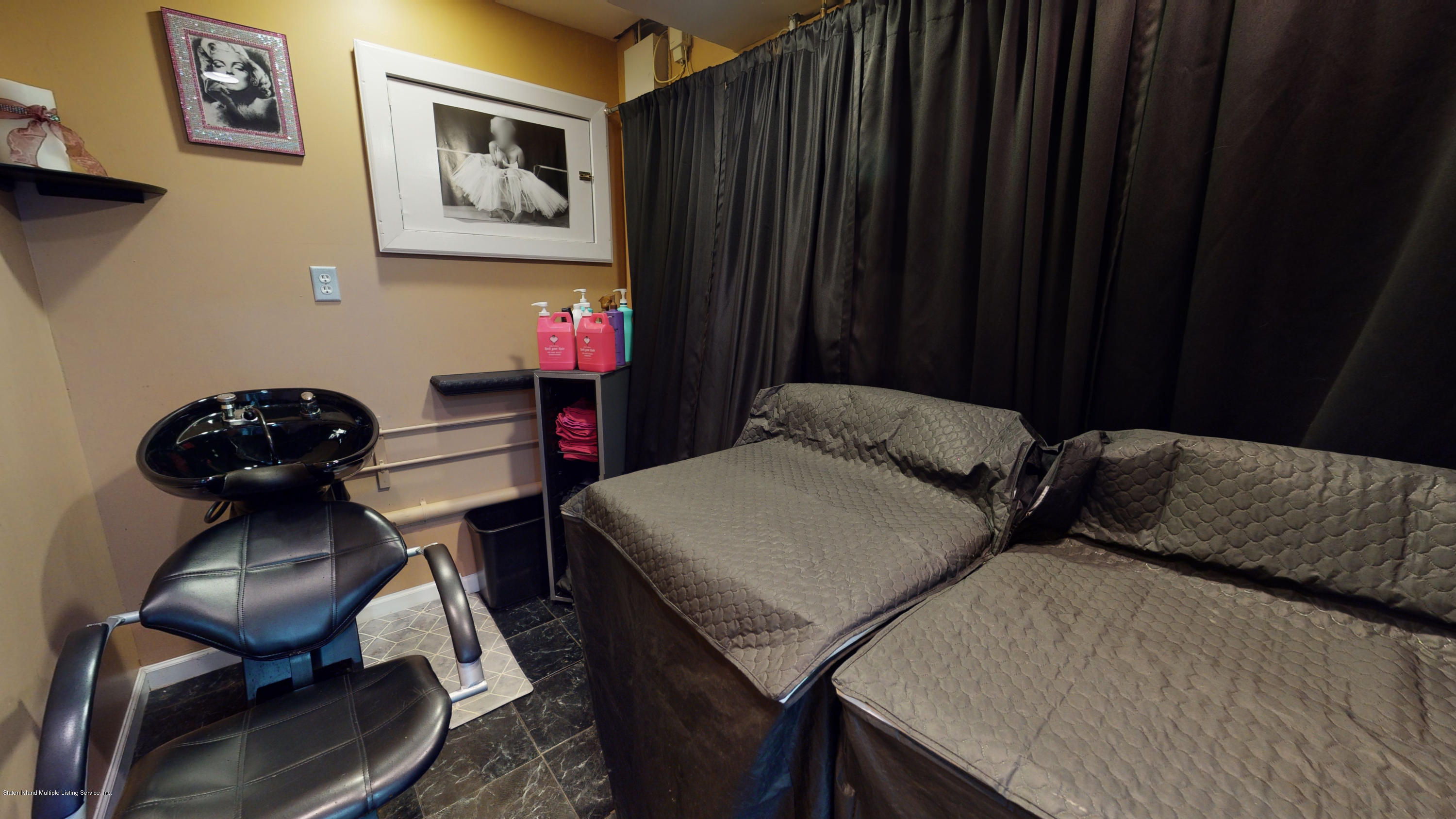 103 Covington Circle Staten Island, NY 10312 - Photo 19 of 21 a view of a room that has a table and chairs