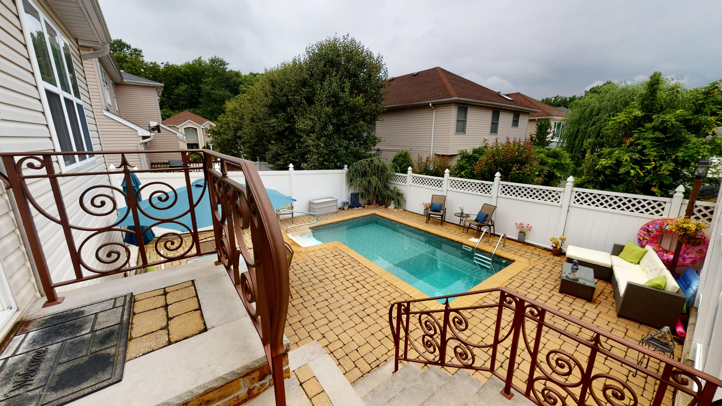 103 Covington Circle Staten Island, NY 10312 - Photo 20 of 21 a view of a chairs and table in the terrace