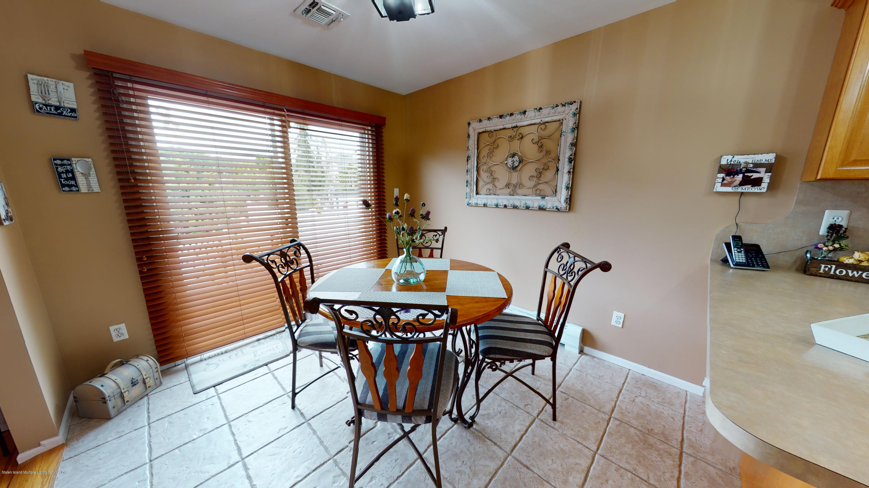 103 Covington Circle Staten Island, NY 10312 - Photo 3 of 21 a dining room with furniture and window