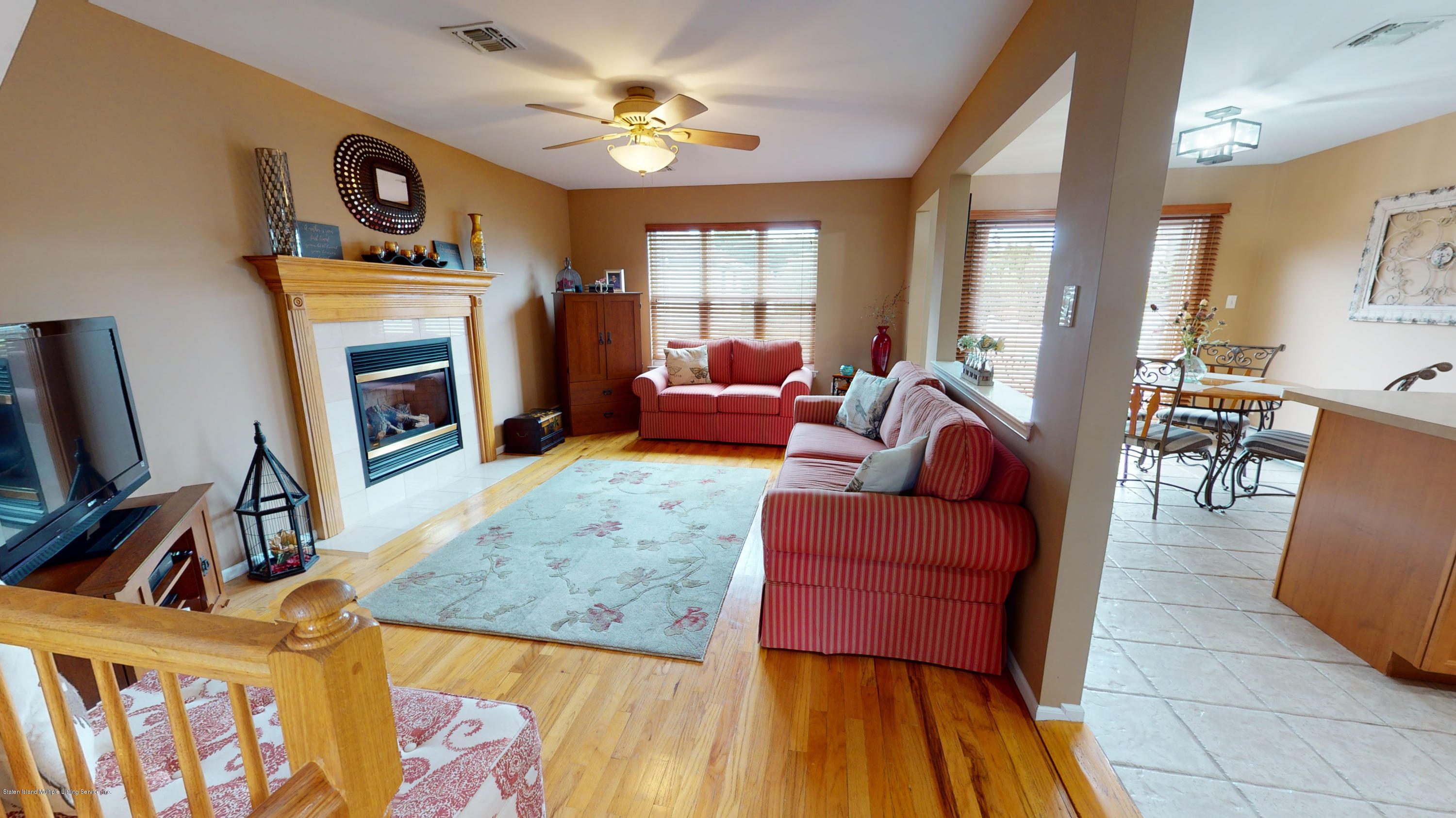 103 Covington Circle Staten Island, NY 10312 - Photo 6 of 21 a living room with furniture fireplace and a window