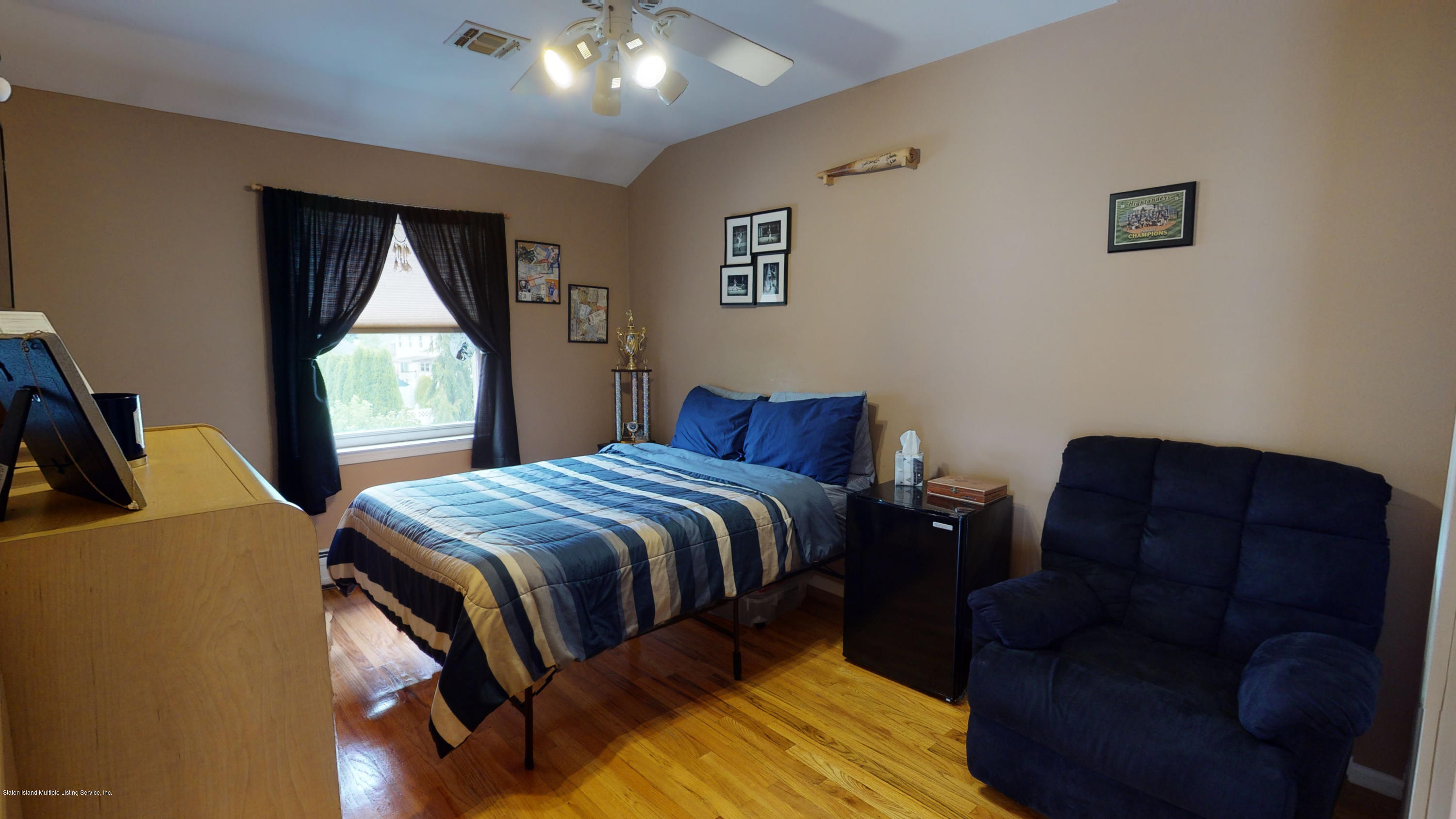 103 Covington Circle Staten Island, NY 10312 - Photo 10 of 21 a bedroom with a bed and window